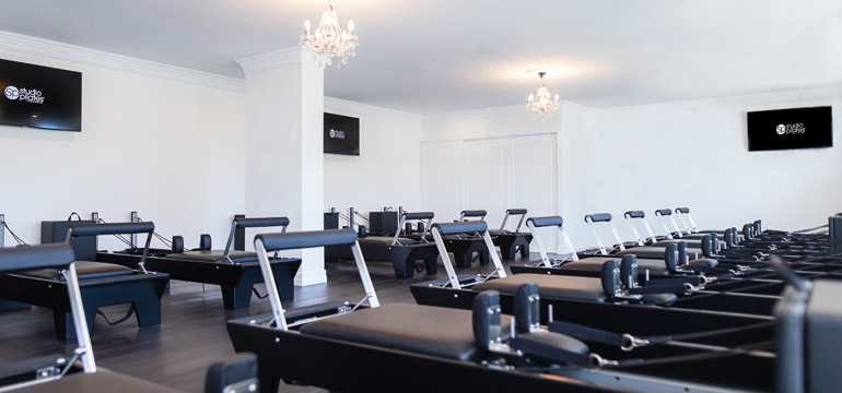 Pilates Studio Reformer Machines Chandeliers